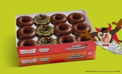Krispy Kreme Taz Chocolate Original Glazed Dozen (with any dozen purchase) – Taz Chocolate Original Glazed Dozen: nine Chocolate Original Glazed plus three new Taz Chocolate Tornado doughnuts with green icing swirl, chocolate cookie pieces and sprinkles
